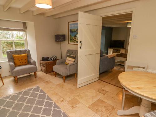 a living room with a table and chairs at Sea View in Newport