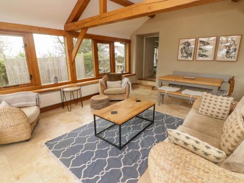 a living room with couches and a table at Sea View in Newport