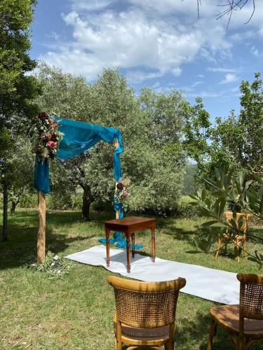 a table with a flower arrangement on top of it at Agriturismo San Carlo in Pomarance