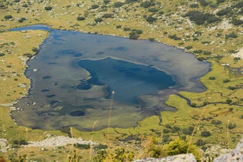 an aerial view of a lake in a field at Family hotel Iskar in Govedartsi