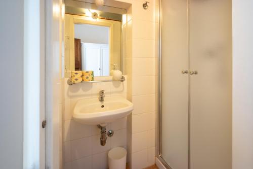 a bathroom with a sink and a mirror at Hotel Le Colline in San Gimignano
