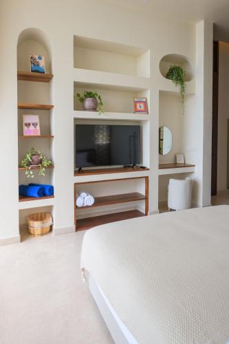 Ένα ή περισσότερα κρεβάτια σε δωμάτιο στο Adika Beach Villas