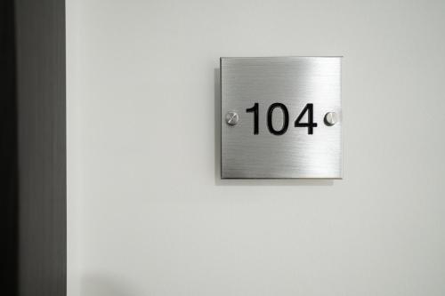 a clock on a wall with the number at Villa Grace Milan in Milan