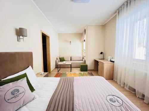 a bedroom with a bed and a living room at Blueberryhouse in Bukovel