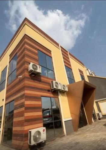 a house with two air conditioners on the side of it at Grand Lynks Homes and Apartments in Gwarinpa