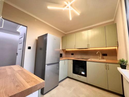 Η κουζίνα ή μικρή κουζίνα στο Wygodne mieszkanie z widokiem na Wisłę