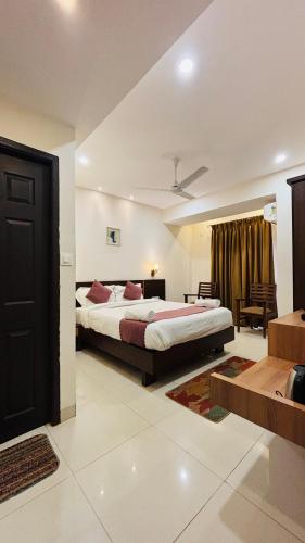 Ένα ή περισσότερα κρεβάτια σε δωμάτιο στο Hotel Assagao Grand