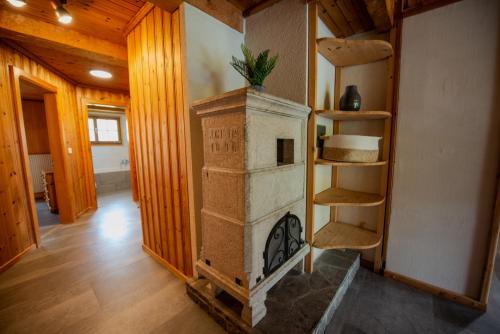 a living room with a fireplace in a house at Chalet aux Portes du Soleil avec balcon in Val-d'Illiez