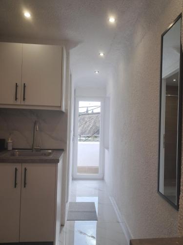 Η κουζίνα ή μικρή κουζίνα στο Funky, cute flat close t center