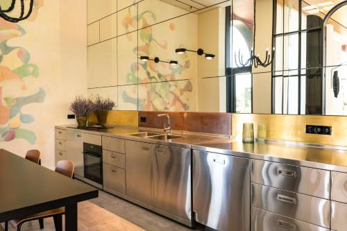 a large kitchen with a sink and a table at Tsinandali Estate, A Radisson Collection Hotel in Tsinandali