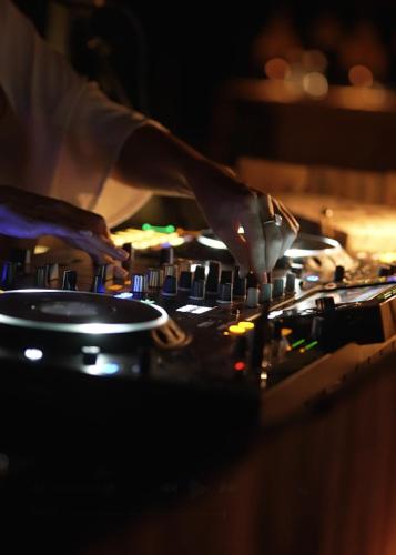 a person playing an electronic music instrument at La Farm Baleares in Santa Maria del Camí
