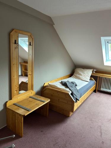 a bedroom with a bunk bed and a mirror at Bad Bruckhaus Erlebnishotel in Waldshut-Tiengen