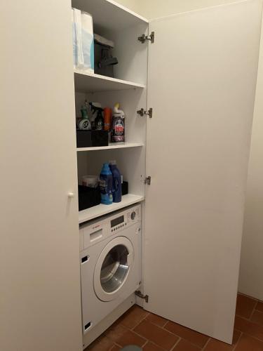 a laundry room with a washer and a washing machine at Luxury Penthouse with 2 Pools in a Monastery in Tavira
