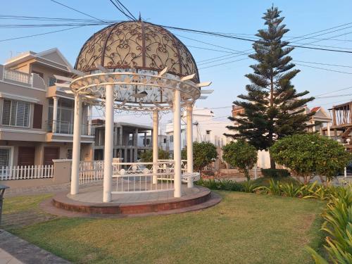 a gazebo in a yard in front of a house at MYSA Luxurious Homestay near Airport Bhopal in Bhopal