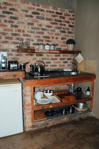a kitchen with a counter with pots and pans at Breathe River Retreat in Parys