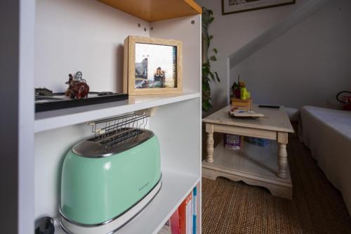 a small room with a blue object on a shelf at Bloom and Wood in Padova