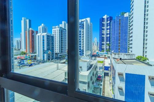 a view of a city from a window at Allure Residence by Carpediem in Recife