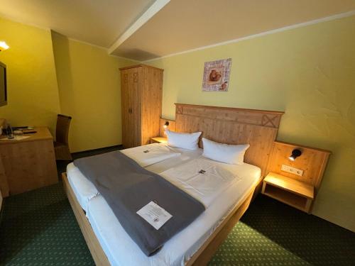 a bedroom with a large bed in a room at Gasthaus Hotel Adler in Endingen