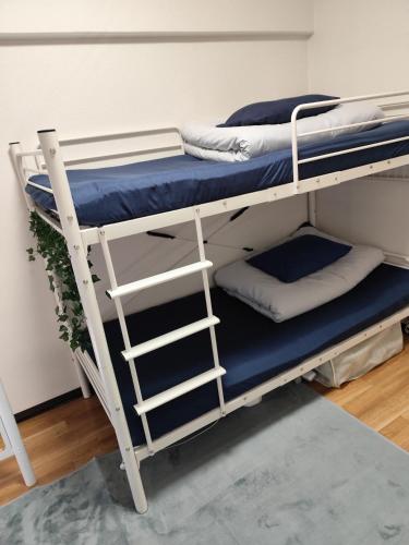 a couple of bunk beds in a room at JKhouse4 in Fukuoka