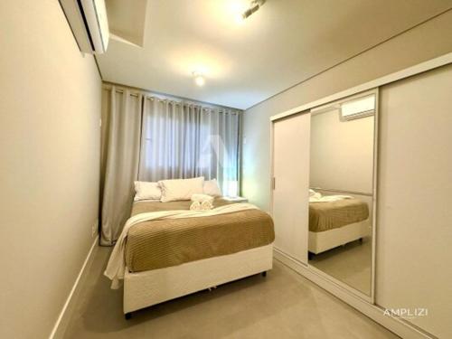 Ένα ή περισσότερα κρεβάτια σε δωμάτιο στο Live Residence Amplizi