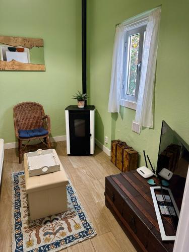 a living room with a couch and a table at Rose's Cottage Foz in Foz do Arelho