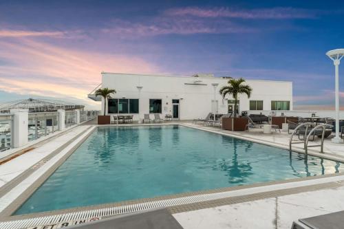 a large swimming pool on top of a building at Experience St. Pete Charming 1 Bed by Tropicana in St. Petersburg