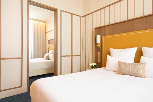 Katil atau katil-katil dalam bilik di Grand Hotel Beauvau Marseille Vieux-Port - MGallery Collection