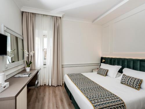 Hotel Michelangeloにあるベッド