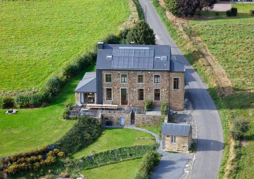 an aerial view of a house with a road at Gîtes de Baya in Ohey