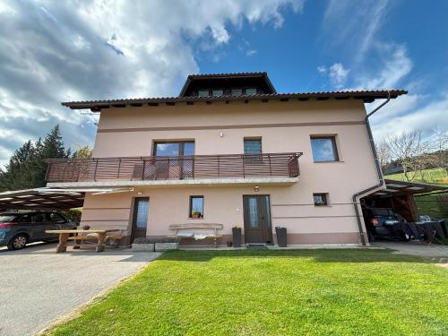 a house with a balcony on top of it at Apartment Panorama in Zreče