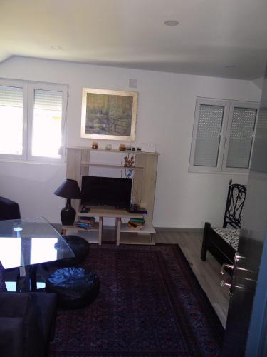 a living room with a couch and a table at Kuca Aura in Višegrad