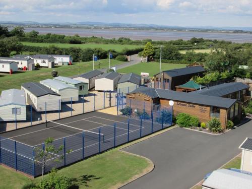 an aerial view of a tennis court and buildings at Shelly's Stay in Port Carlisle