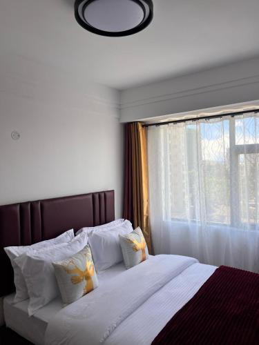 Ένα ή περισσότερα κρεβάτια σε δωμάτιο στο Colly homes