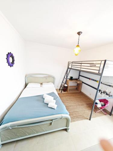 a bedroom with a bunk bed and a ladder at Blife Paulya private apartment in FAO