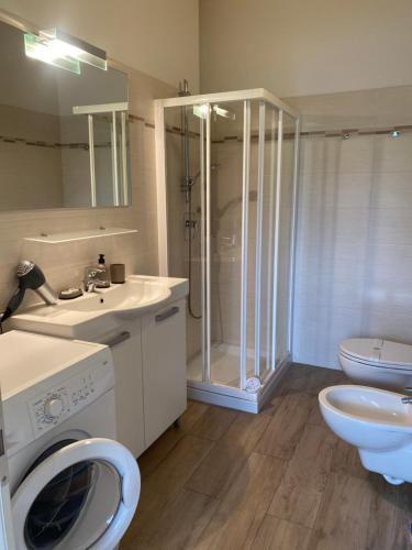 a bathroom with a toilet sink and a shower at MONTE MISONE 2.0 in Comano Terme