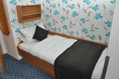 Postel nebo postele na pokoji v ubytování Hotel Kühns Mühle