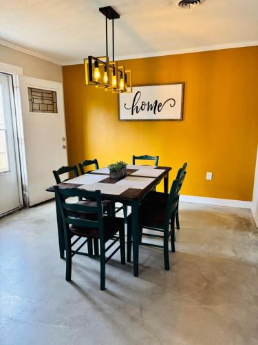 a dining room with a table and chairs at Big home in the heart of Sulphur in Sulphur