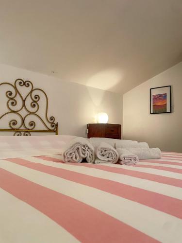 Ένα ή περισσότερα κρεβάτια σε δωμάτιο στο Casa Vacanze La Casa di Nonna Libia vicino Saturnia