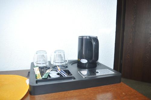 Příslušenství pro přípravu čaje a kávy v ubytování Hotel Kühns Mühle