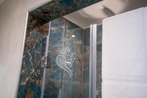 a bathroom with a mural of a mermaid on the wall at Leone Camere D'autore - Rooftop Prince Centro Storico in Naples