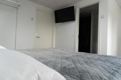 Postel nebo postele na pokoji v ubytování Birkelse Hotel og Kro