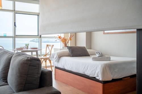 Ένα ή περισσότερα κρεβάτια σε δωμάτιο στο Estudio en Playa San Lorenzo