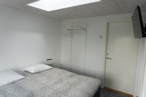 Postel nebo postele na pokoji v ubytování Birkelse Hotel og Kro