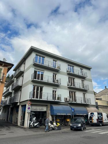 a tall building with motorcycles parked in front of it at Borgo Trento Residence in Verona