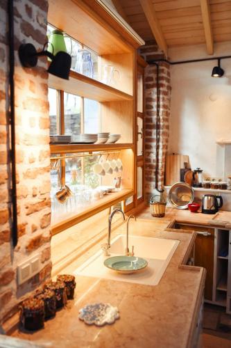 a kitchen with a sink and a counter top at Nisanyan Hotel in Selcuk
