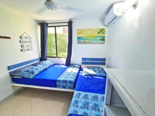 Cama o camas de una habitación en Lujosa cabana con piscina playa y servicio