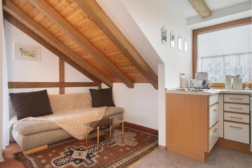 a living room with a couch and a table at Hotel Garni Vitamari in Wasserburg am Bodensee