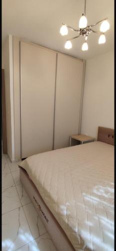 Кровать или кровати в номере Luxury Beach Apartment