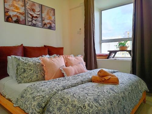 Katil atau katil-katil dalam bilik di Aevia Home Bayview Apartment at PD