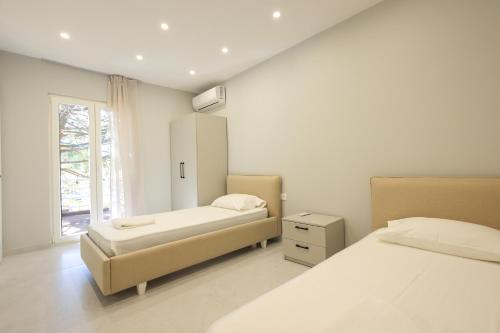 Postel nebo postele na pokoji v ubytování Grandstay Villa Perla Resort